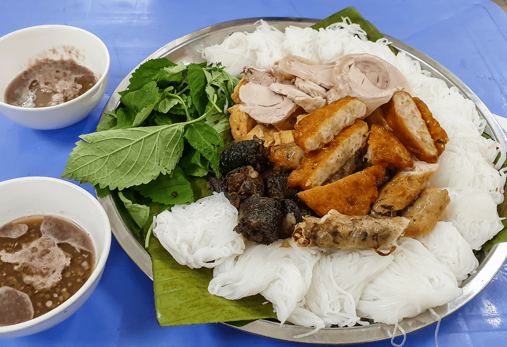 Locals savor Bun dau mam tom by mixing the shrimp paste with lime juice, sugar, chili, and eating it with various toppings (Source: Canva)